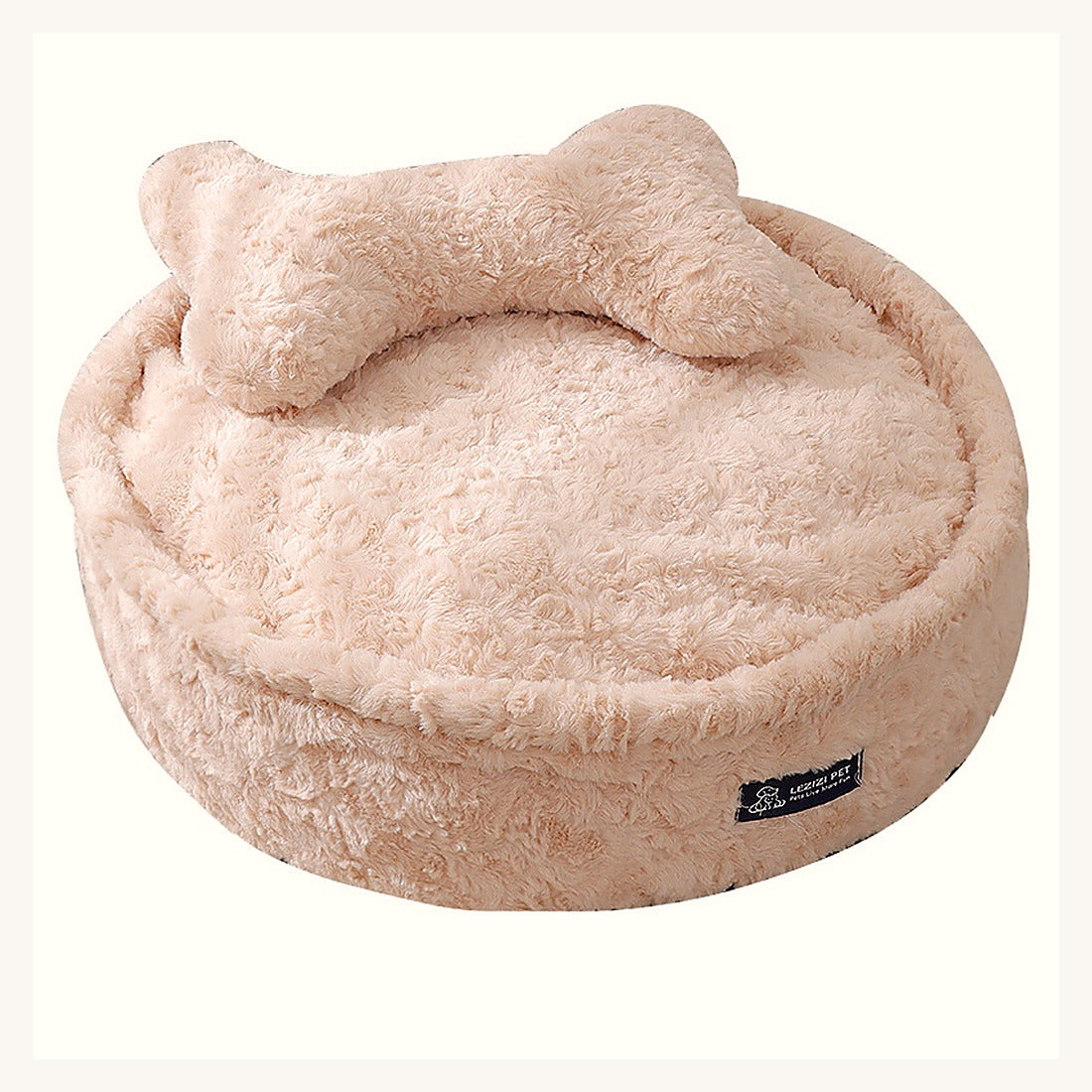 Le lit rond vu de dessus avec son coussin en forme d'os